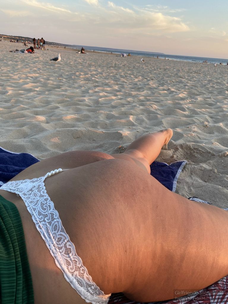 Girlfriend dressed in pearls on the beach