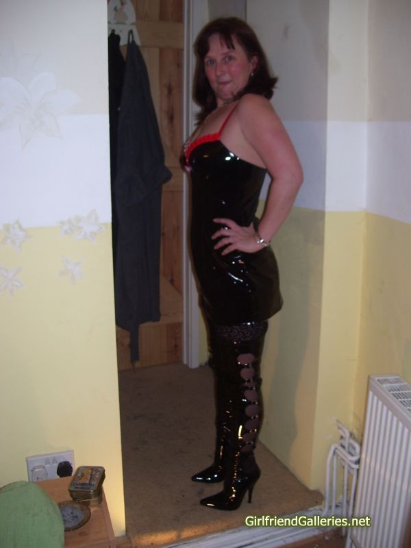 Slut wife Dec in Pvc dress and boots with black stockings