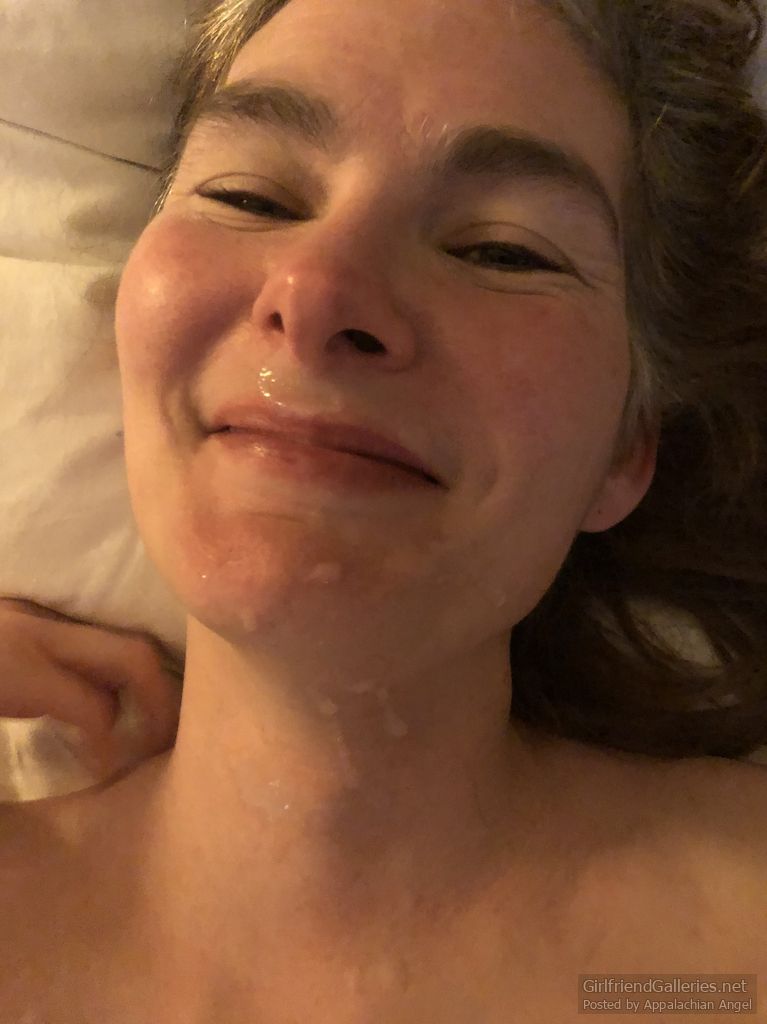 An angel on a hotel bed