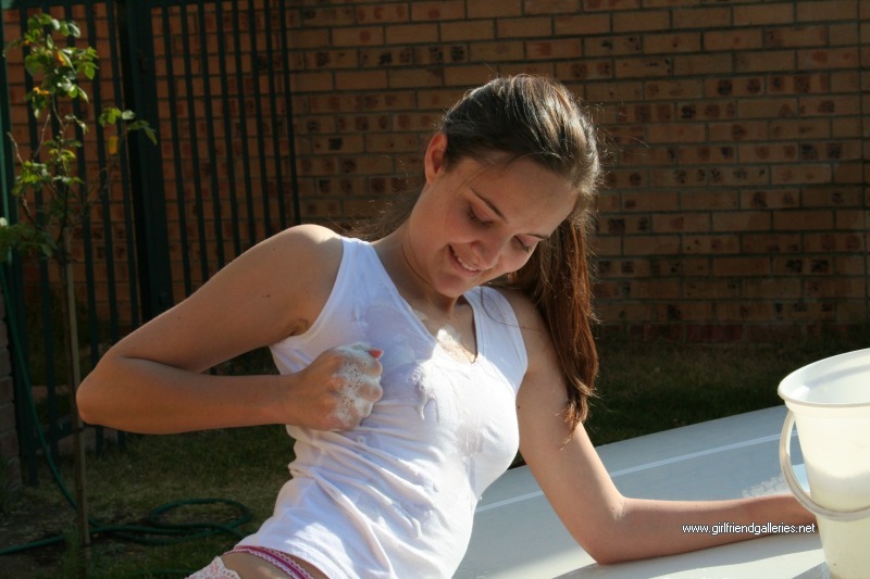 Slutty Davida getting wet and naked washing her car