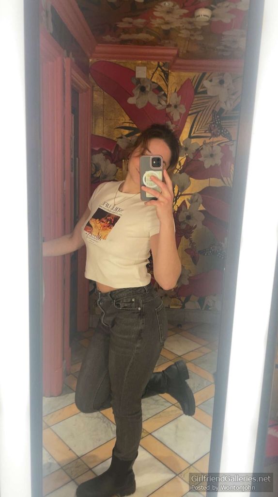 Flashing her tits in the bathroom